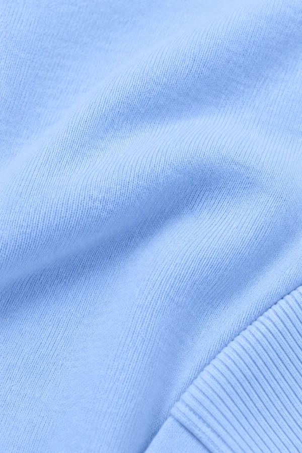 Sky Blue zip-up hoodie and jogger set, illustrative fabric close-up