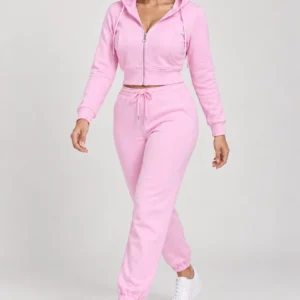 Pink zip-up hoodie and jogger set, walking hood-up view